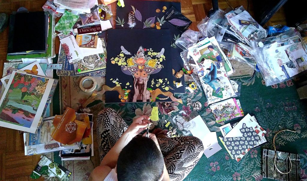 A floor covered in paper, magazines and collage pieces