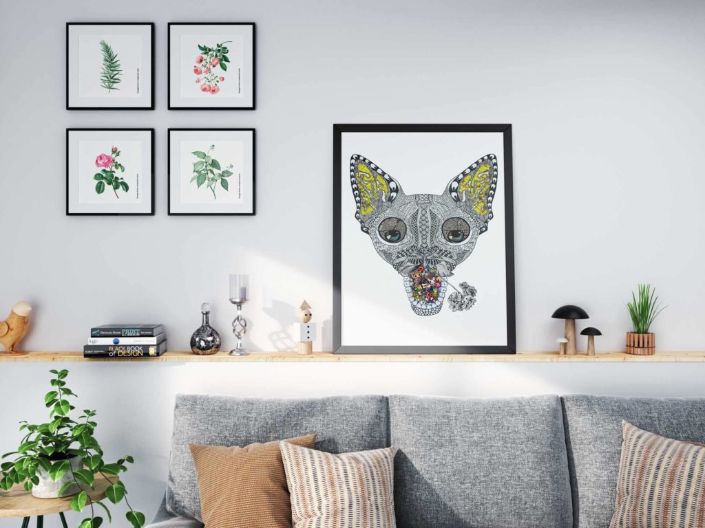 A framed collage print above a sofa