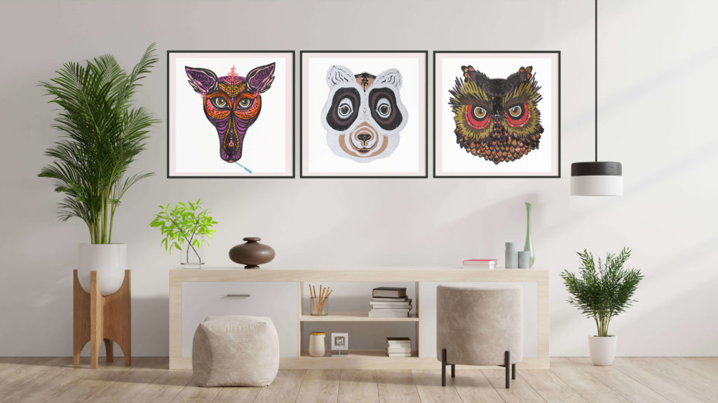 Three framed animal collage prints above a sideboard