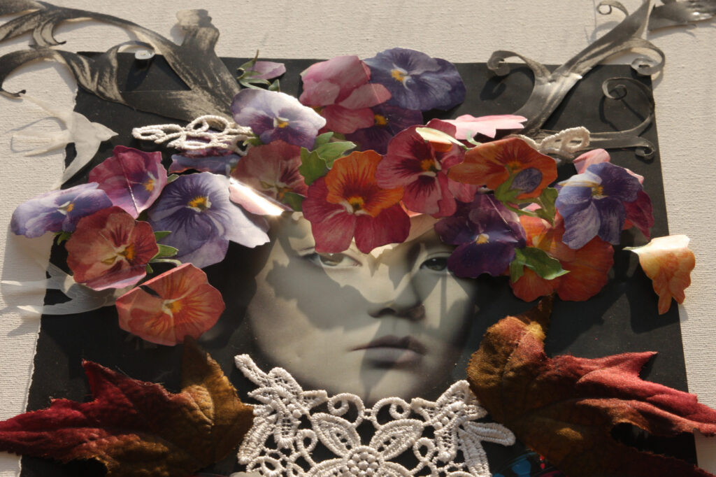 A collage face crowned with pressed flowers and lace