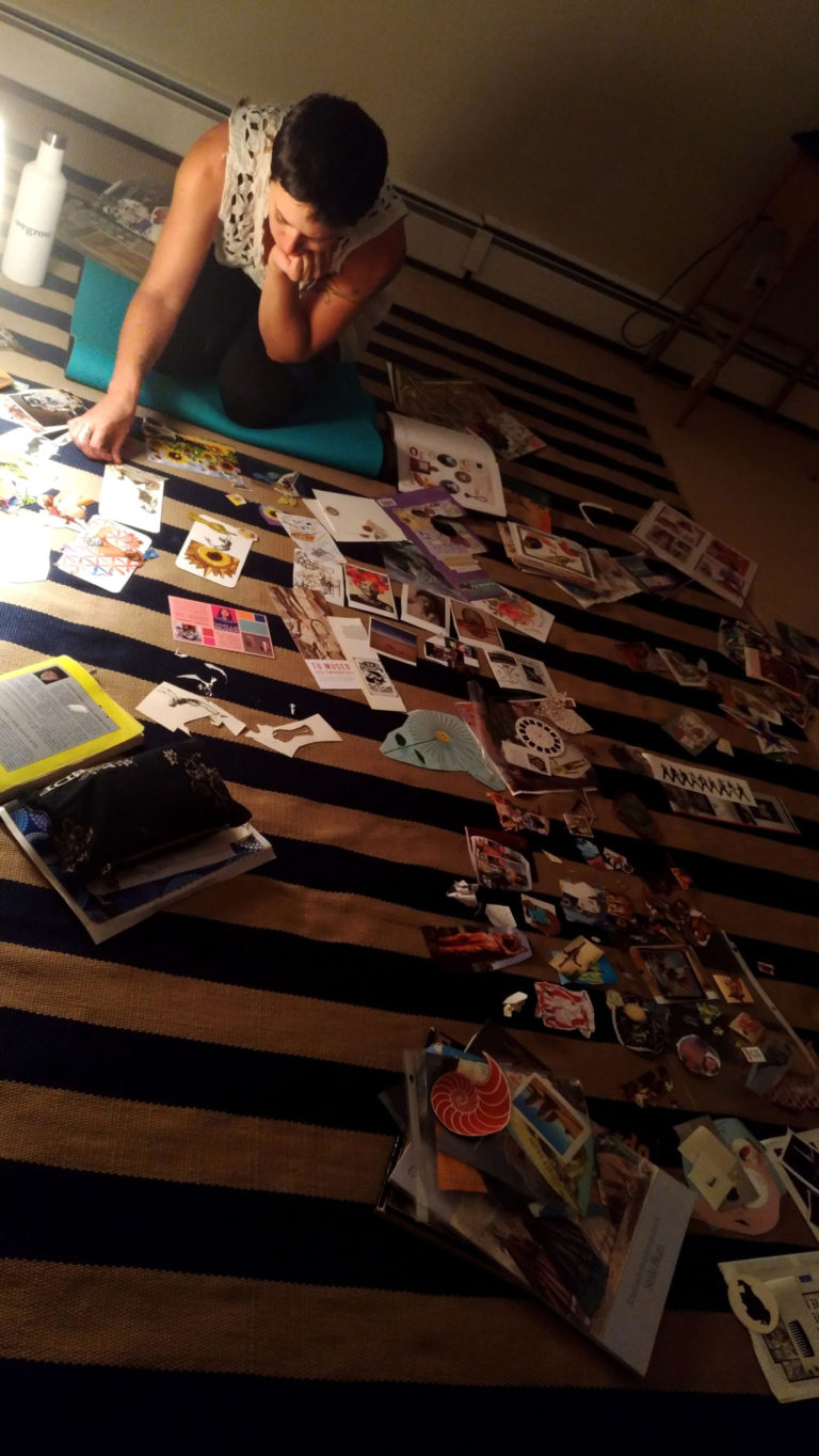 Yisca working on a collage, seen from above